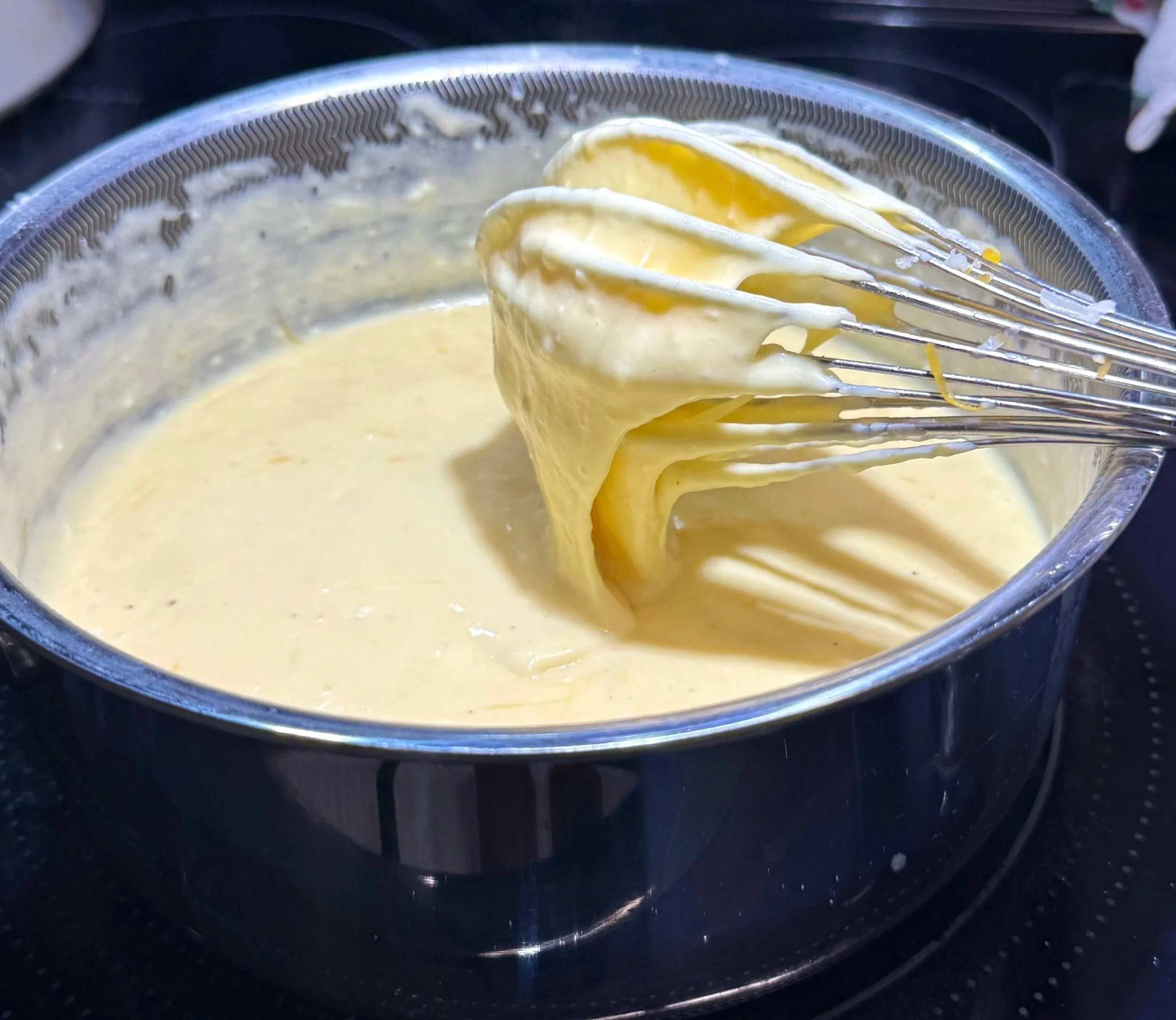 Make a creamy cheese sauce until smooth and velvety—this will top the oxtail.