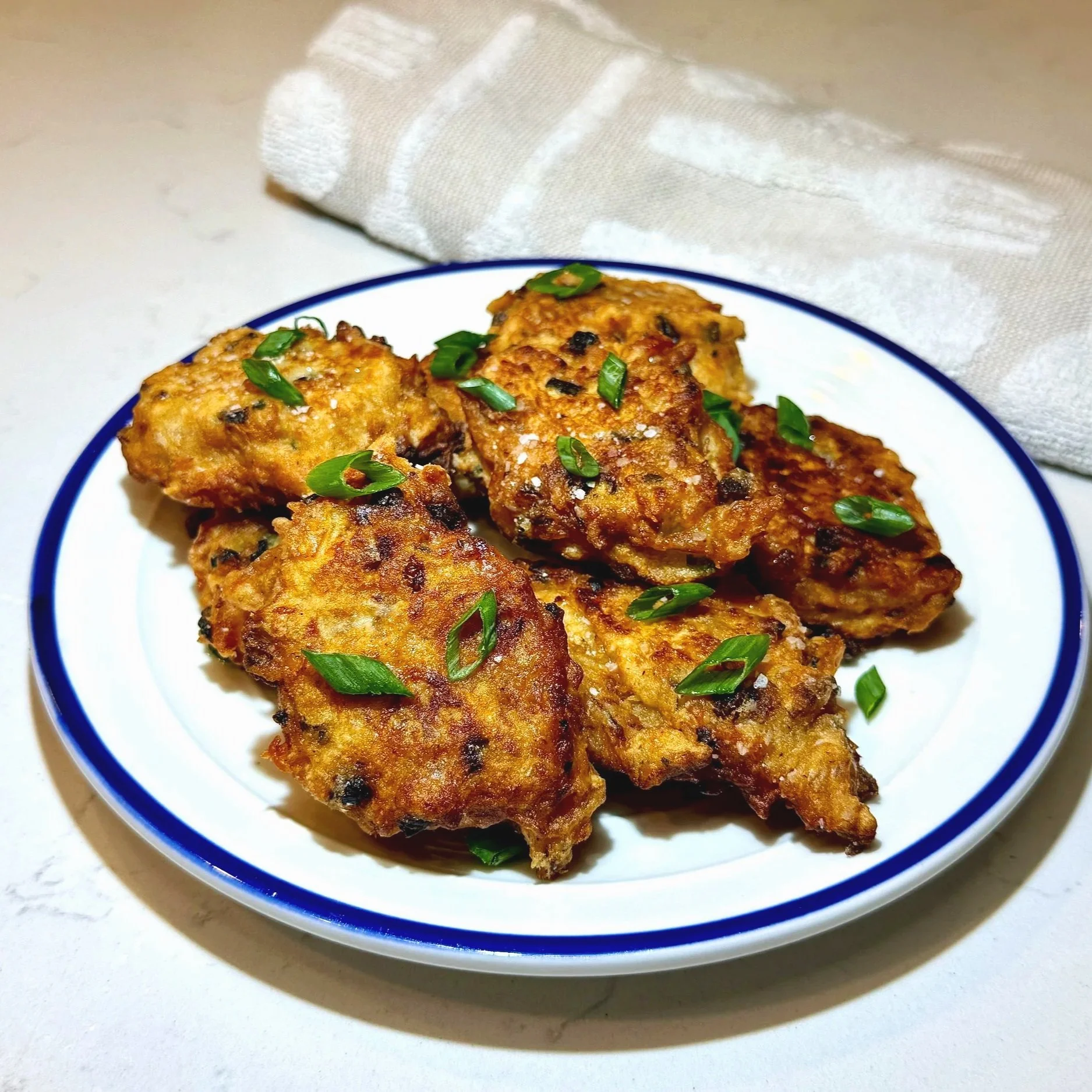 Golden Jamaican salt-fish fritters served hot and crispy, ready to enjoy.