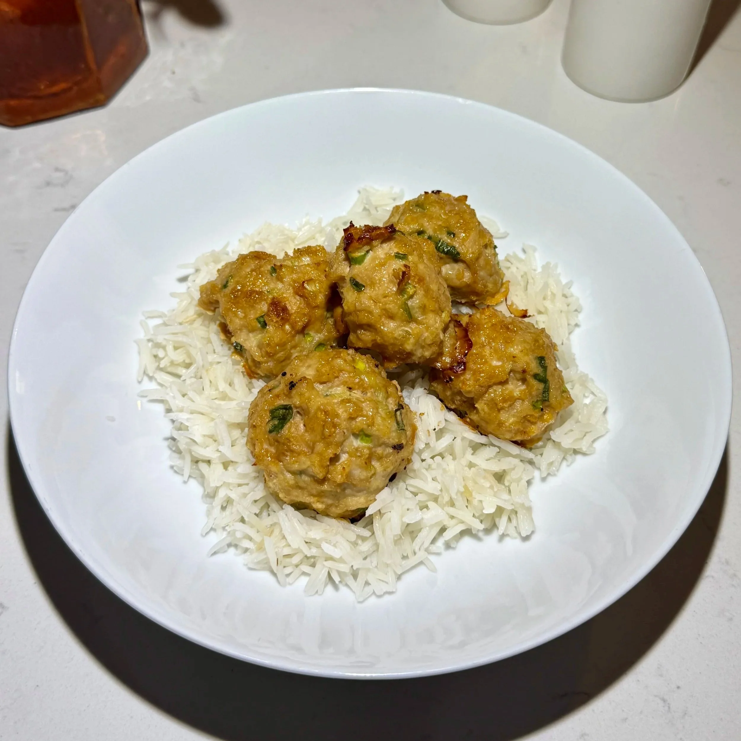   Miso Chicken Meatballs Served Over Rice  