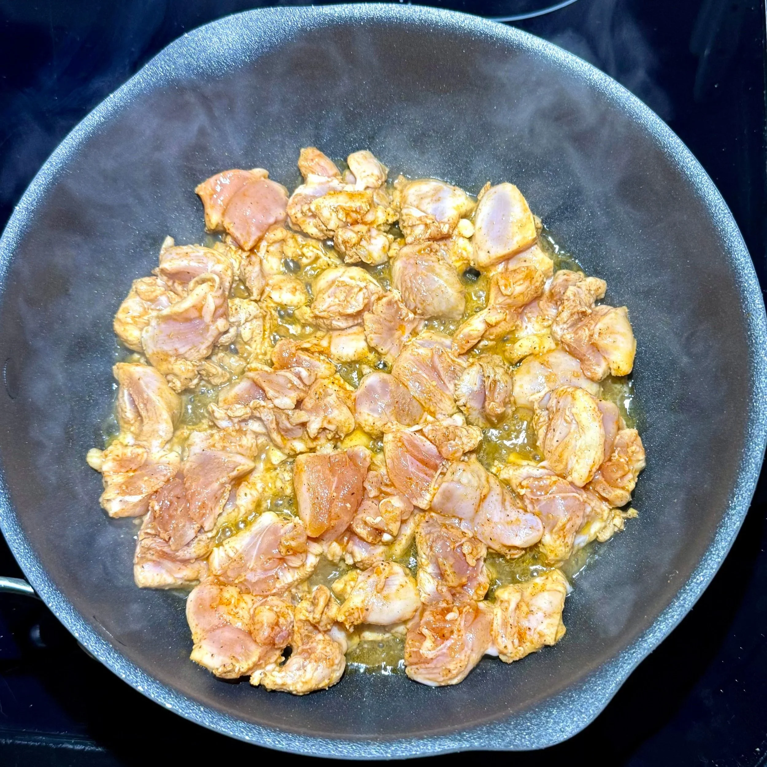   Brown the chicken pieces in oil until golden on the edges  