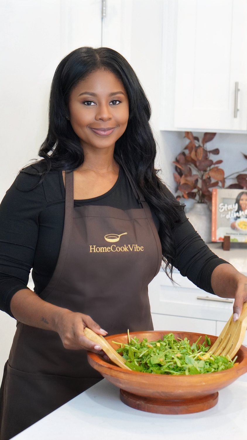 Kim Alexander with her cookbook, Stay for Dinner