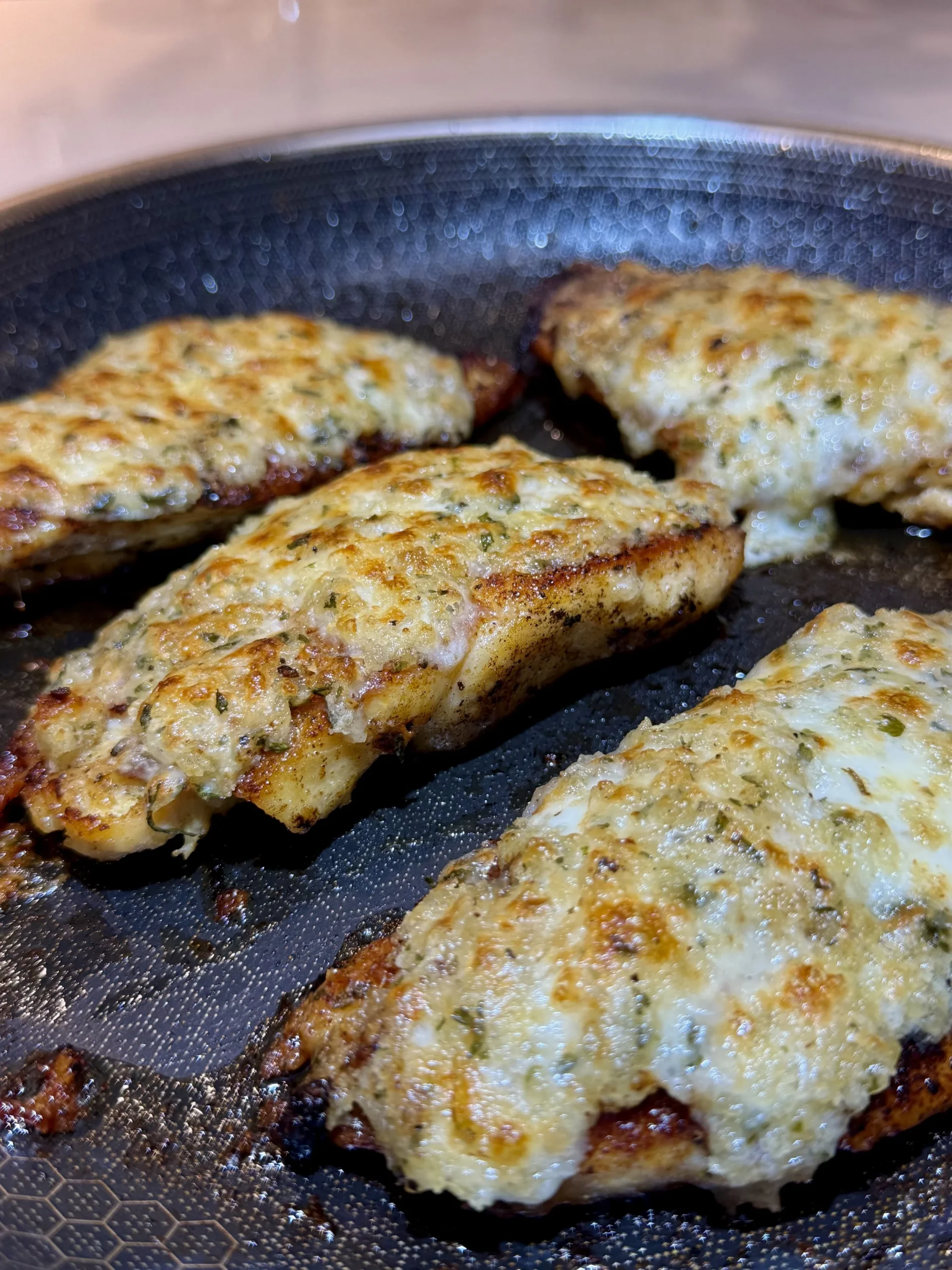  This Parmesan-crusted chicken is inspired by the famous LongHorn steakhouse dish. Tender chicken, a rich cheese topping, and a golden crunchy crust—an easy, restaurant-quality dinner you can make at home. 