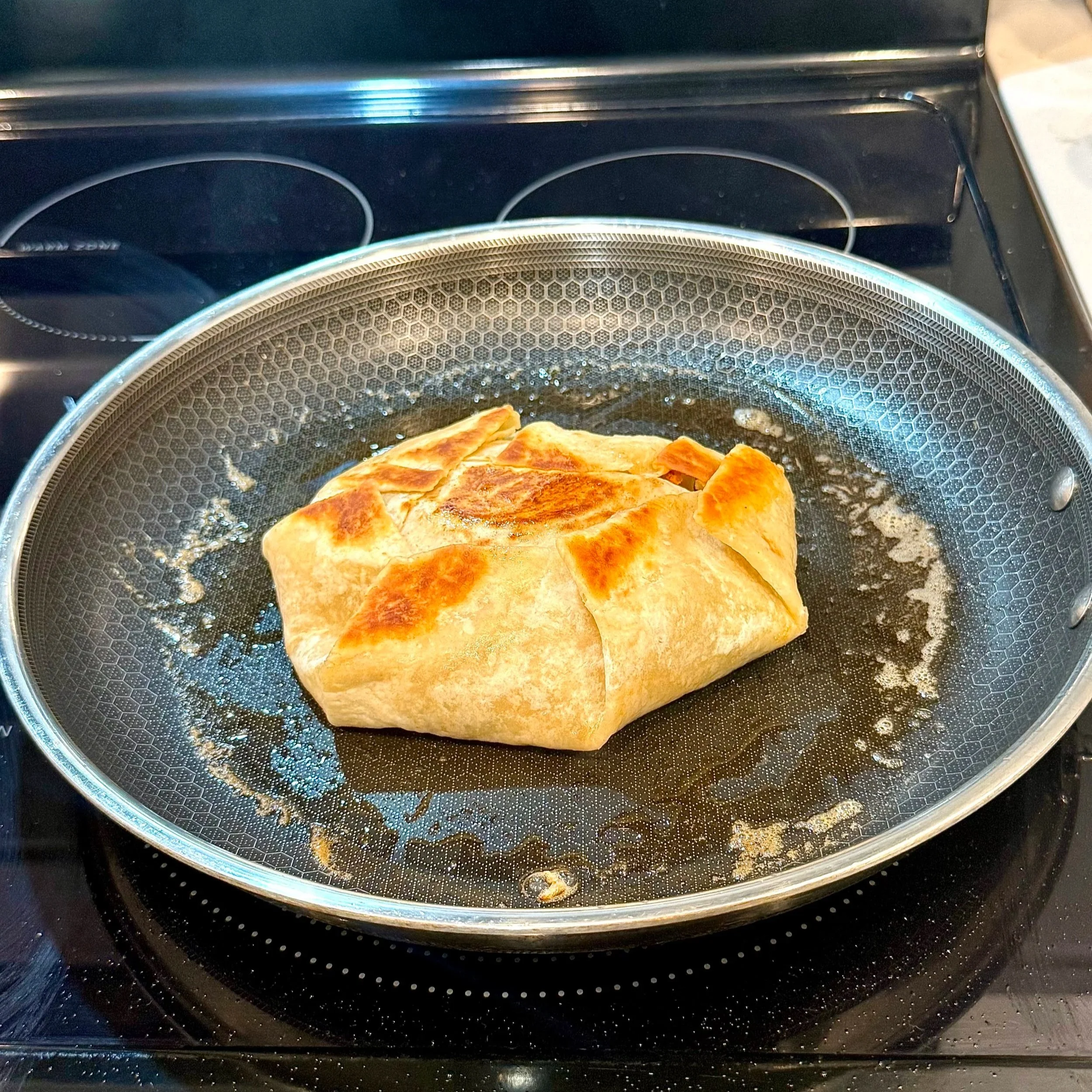  Crisping the wrap in a skillet gives it that perfect golden crunch. 