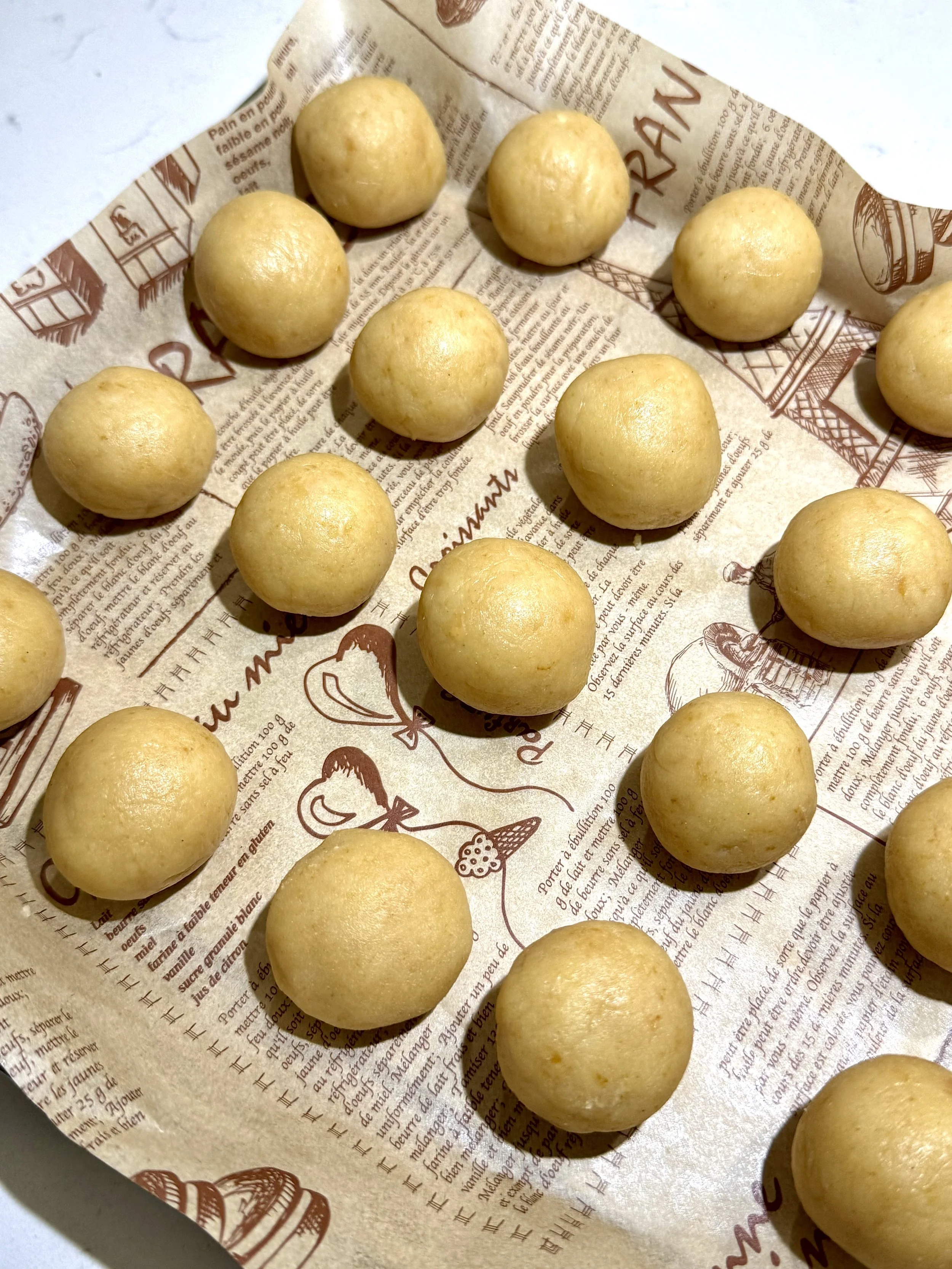 Rolled vanilla cake pop dough balls — soft, smooth, and perfectly shaped before dipping.