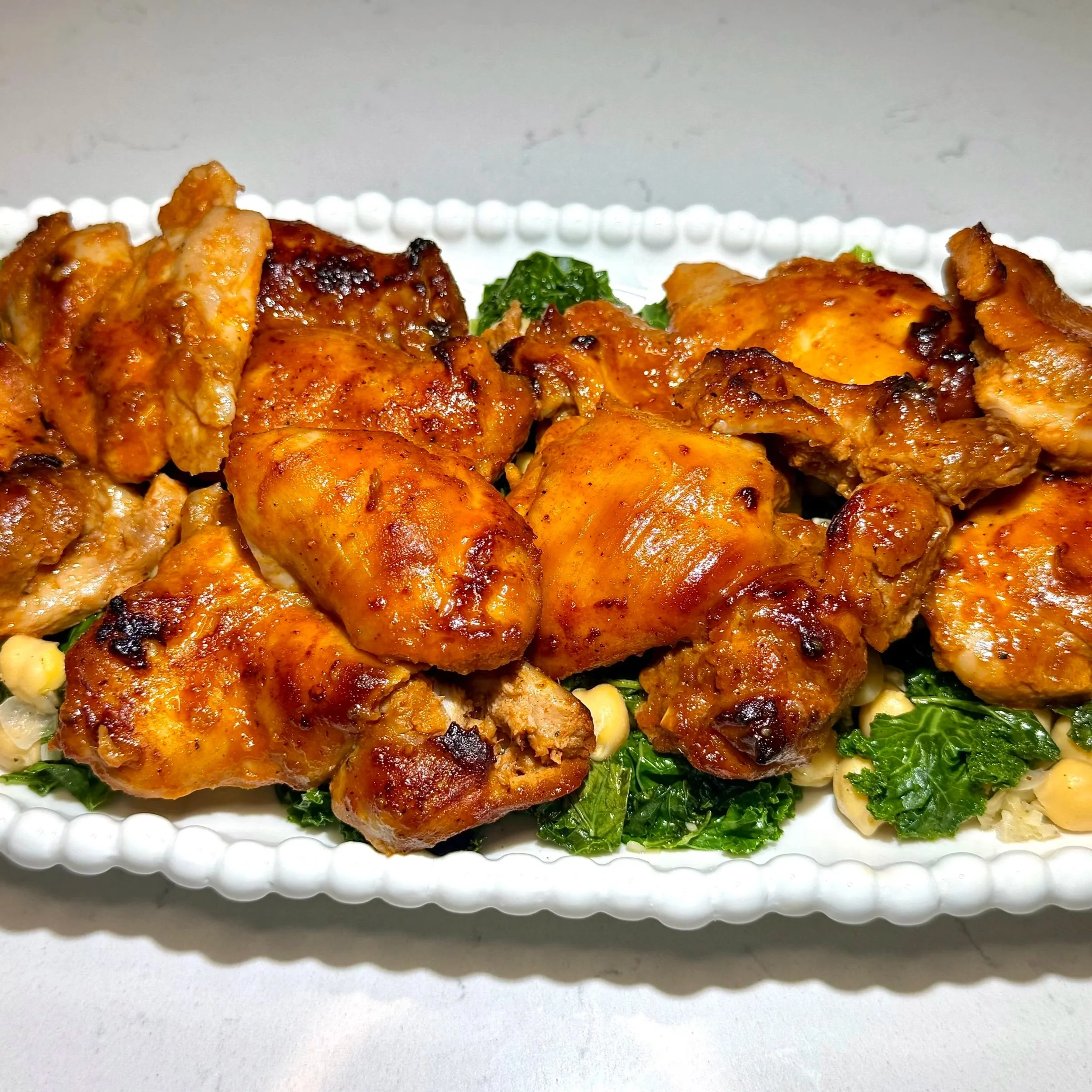 The final dish — bold, balanced, and ready to serve. Sweet‑spicy glaze meets earthy greens for a modern, global dinner.