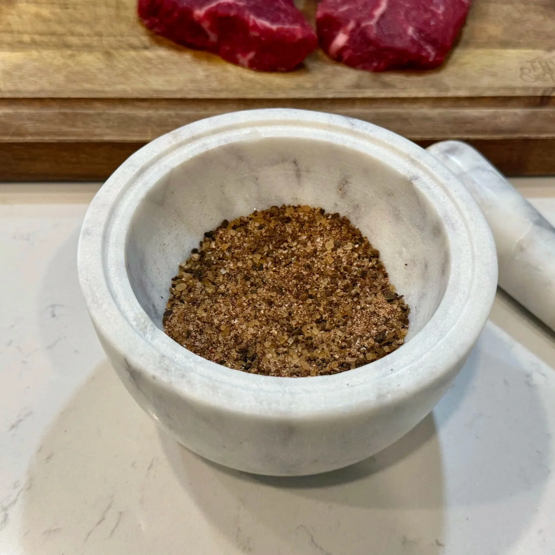 Grind the spices into a coarse crust — this texture gives the steak its signature bark. 