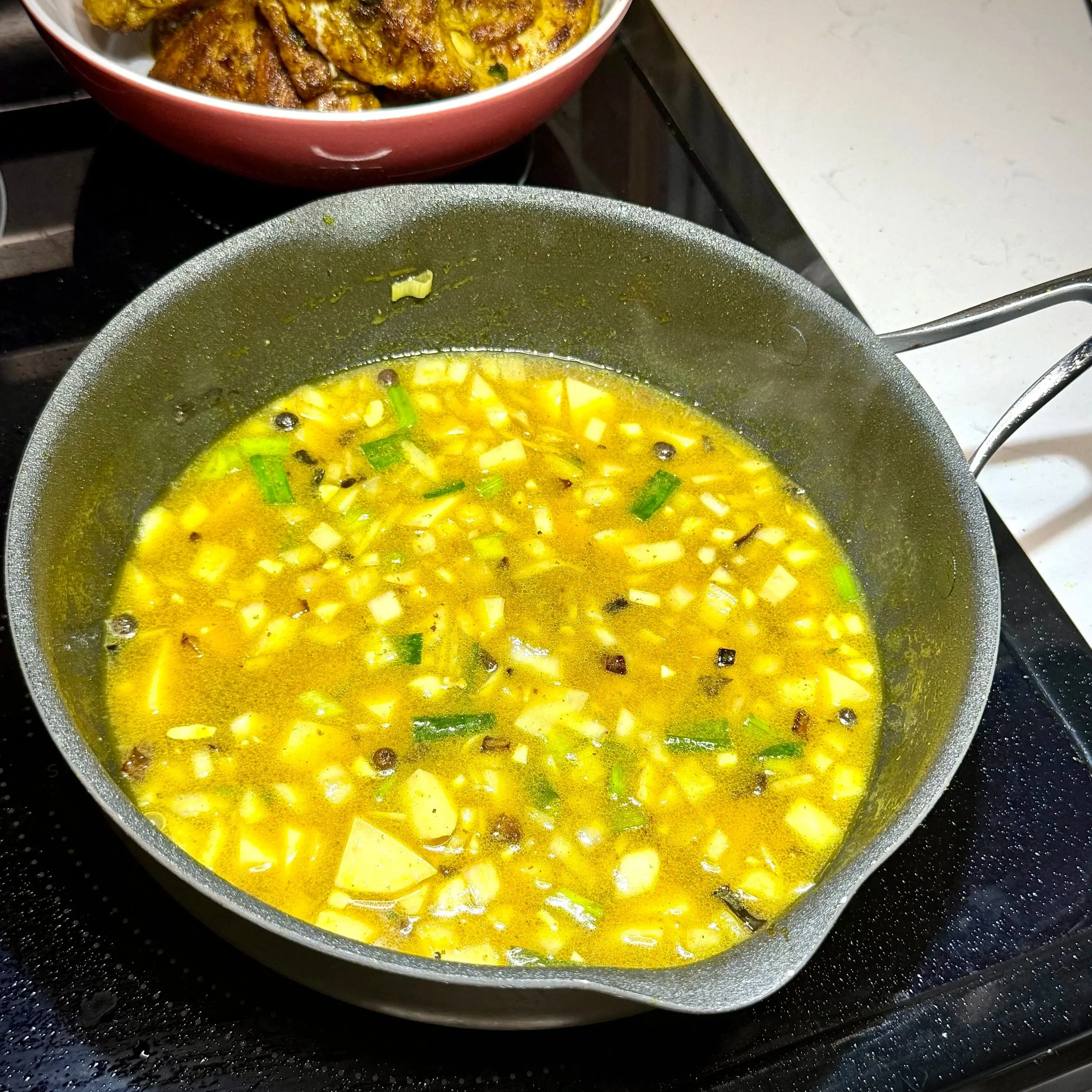  Potatoes simmer in the curry base, naturally thickening the gravy as they soften. 