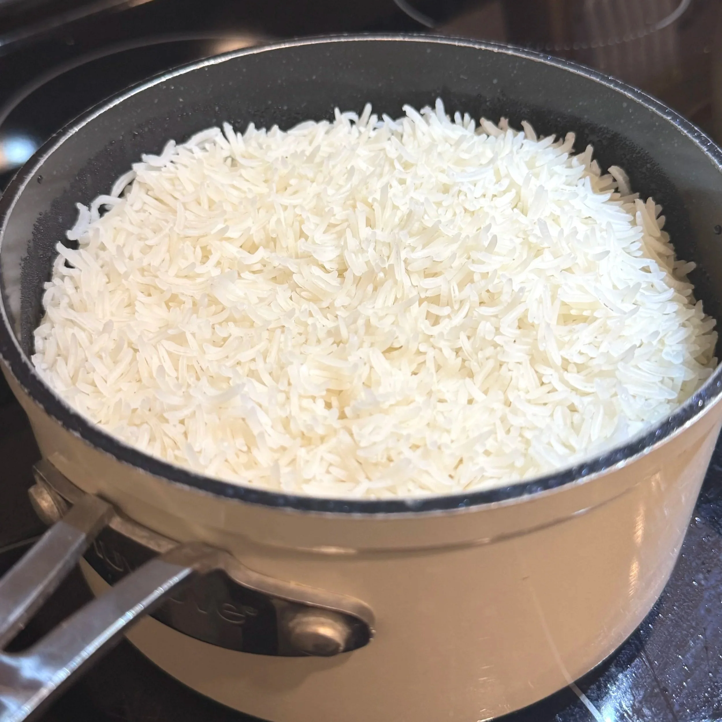  Steamed white rice — the perfect base for soaking up that silky golden curry gravy. 