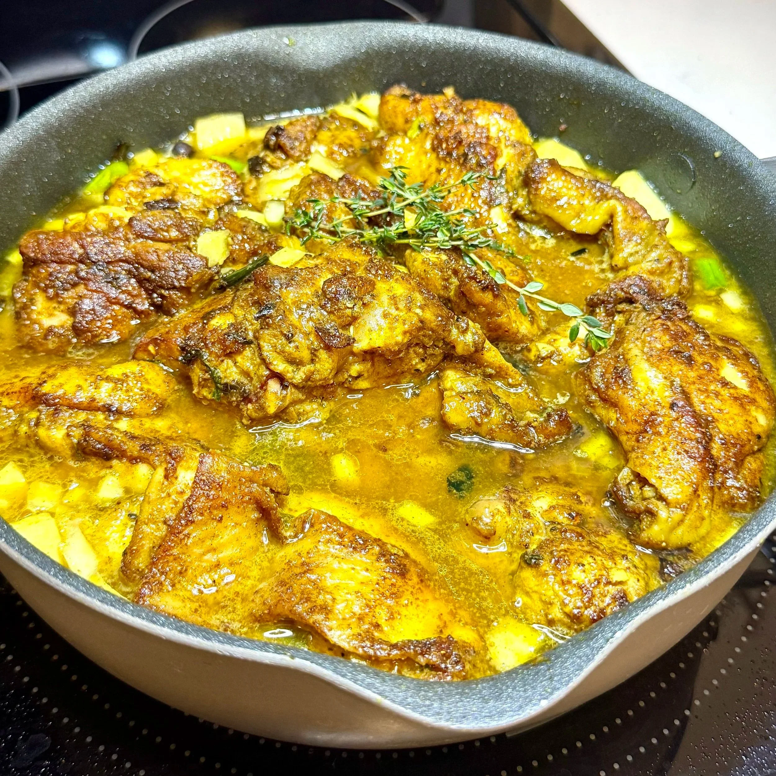  Adding the marinated chicken and all its juices creates a deeply seasoned curry gravy. 