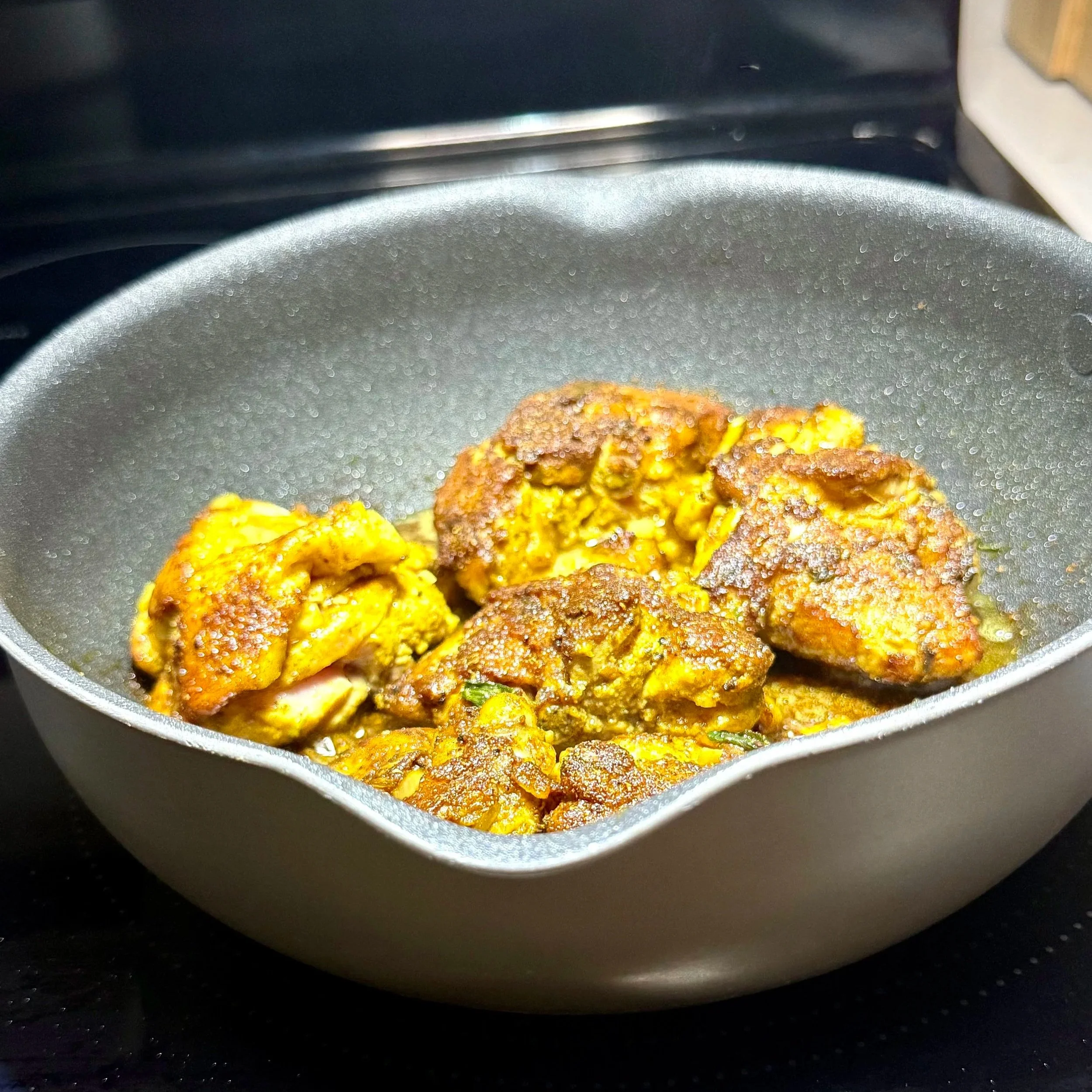  Browning the chicken after burning the curry builds the rich, golden foundation of Jamaican curry chicken. 