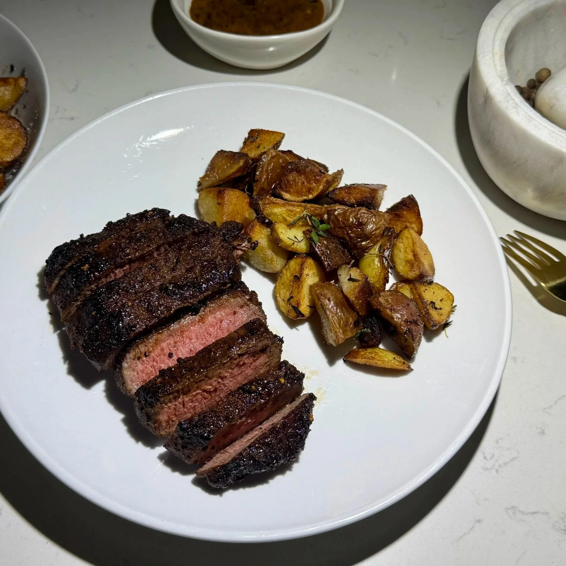  Fan the slices over a small pool of sauce — clean, modern, intentional.” 