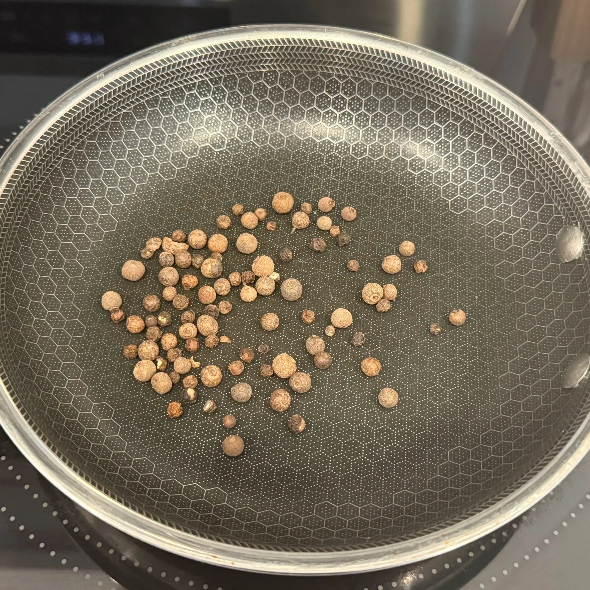  Toast pimento and peppercorns to release their warm Jamaican aroma — the base of the crust. 
